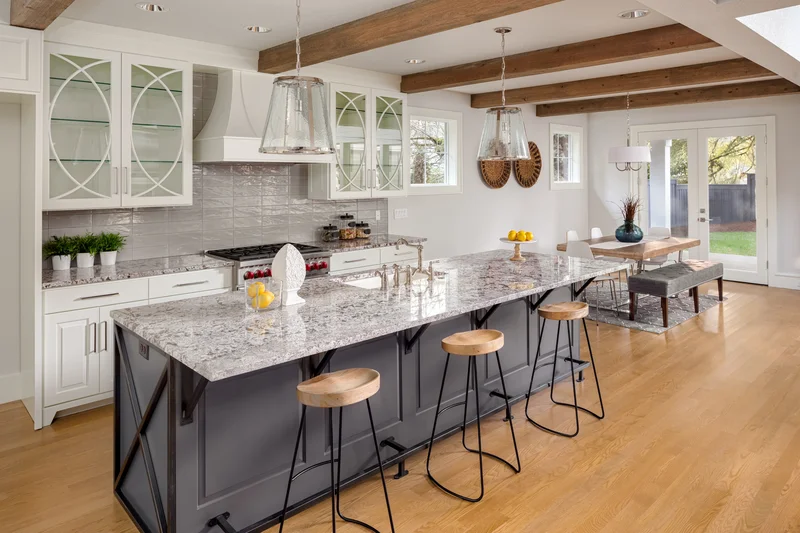 Kitchen island custom cabinet painting in dark charcoal grey.