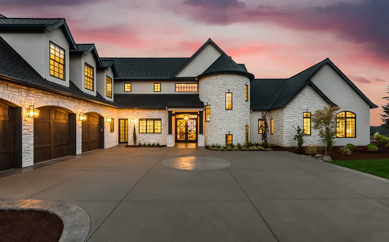 Modern luxury home with freshly painted white stucco and black trim.