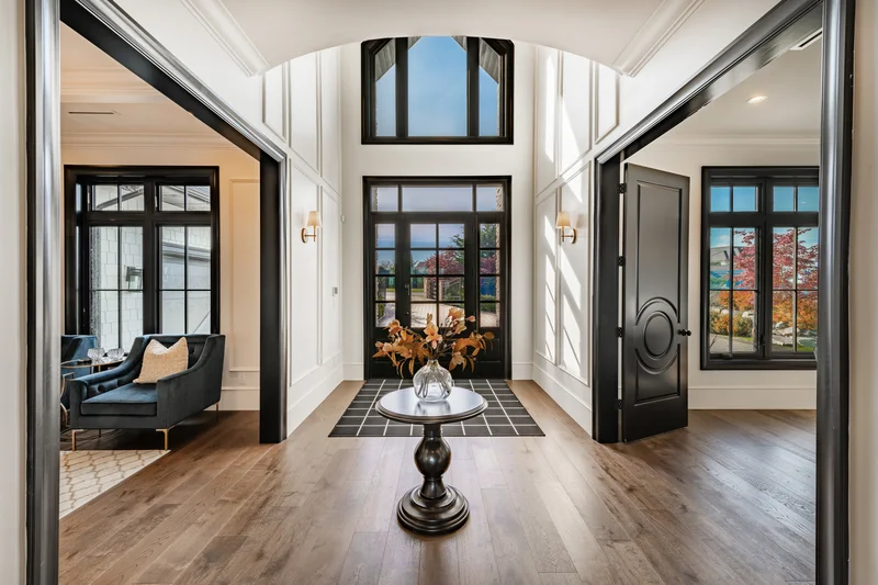 Interior wall and black trim painting in a luxury home entryway.